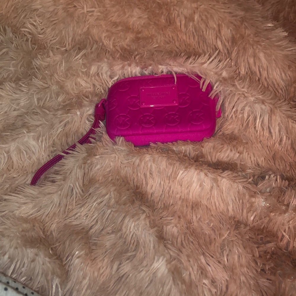 Dark pink Micheal Kors wristlet.